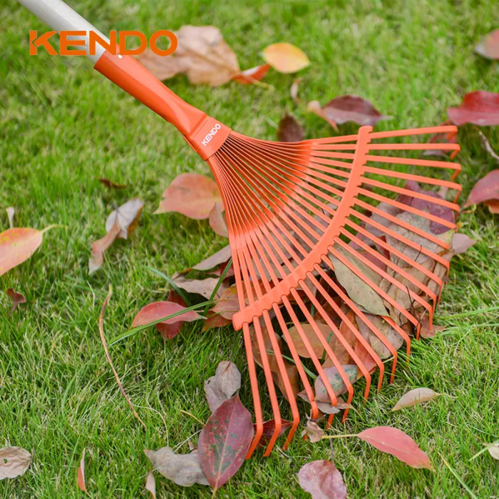 Kendo Gardening Rake Metal Fan 22T in use raking leaves on grass