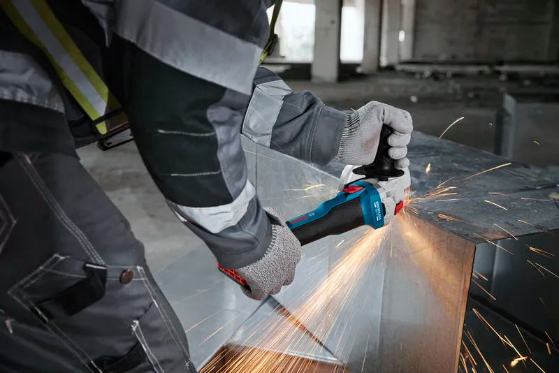 Person using GWS 18V-8 cordless angle grinder to cut metal with sparks flying