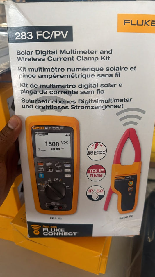 Fluke 283 FC/PV kit box showing multimeter and wireless current clamp