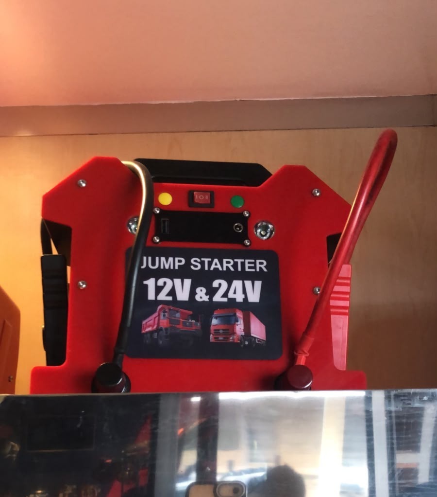 Wedcraft Jump Starter 12V and 24V - red unit with indicator lights and carry handle