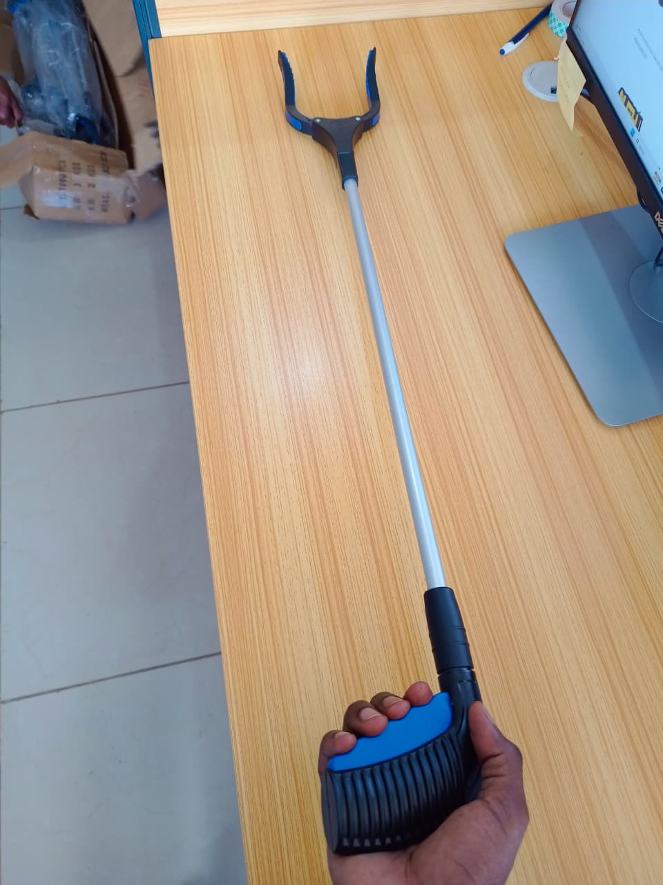 Faithfull Litter Grabber in use picking up litter on floor