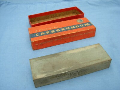 Carborundum UK sharpening stone in its branded orange box