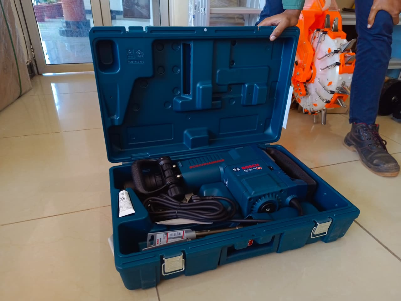 Bosch GSH 11 E demolition hammer in carry case on floor